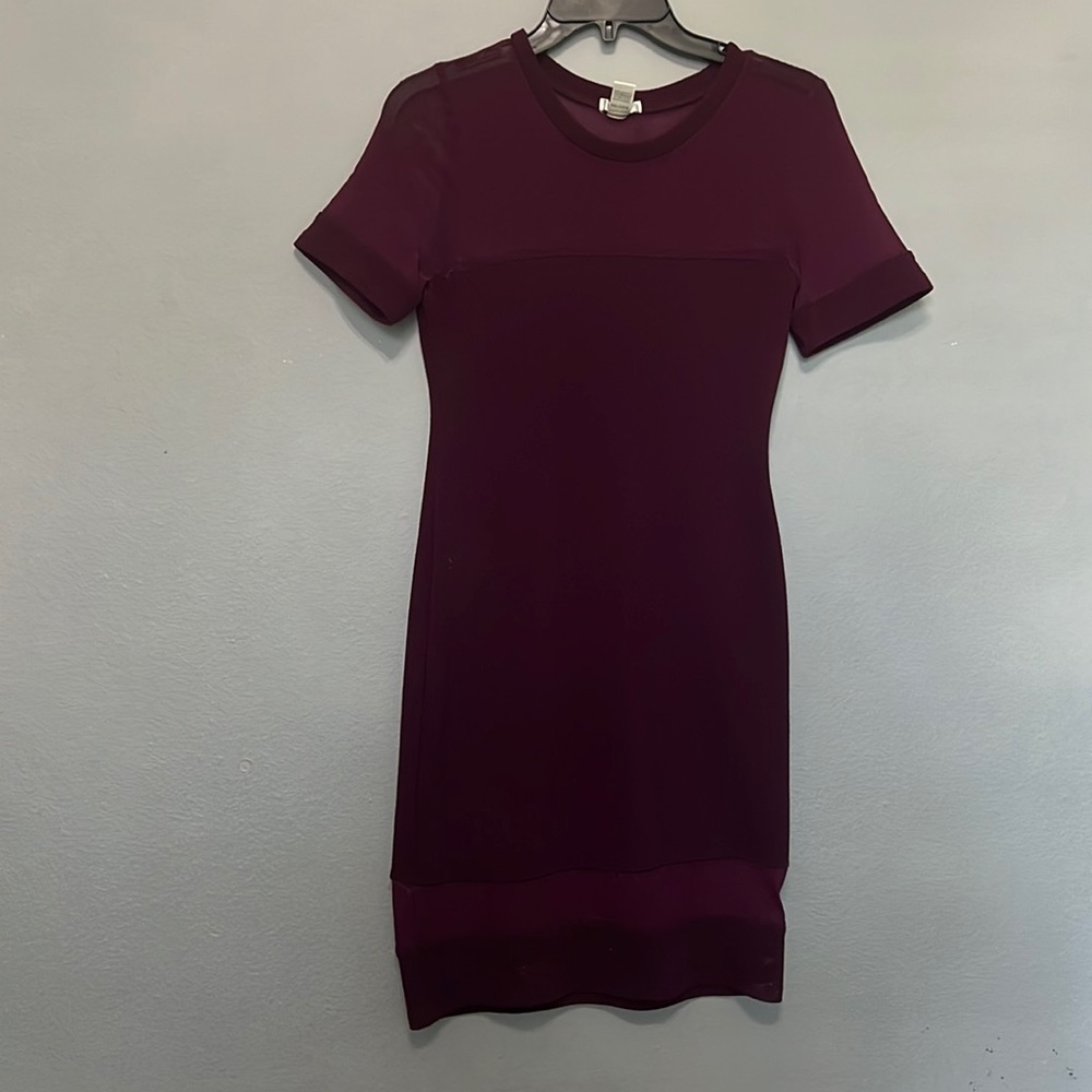 Burgundy dress. The top is sheer in the line on the thigh area is also sheer